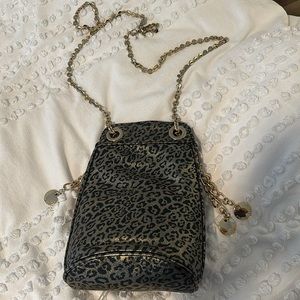 NWT Ivanka Trump shimmery gold and black cheetah print purse with tags.